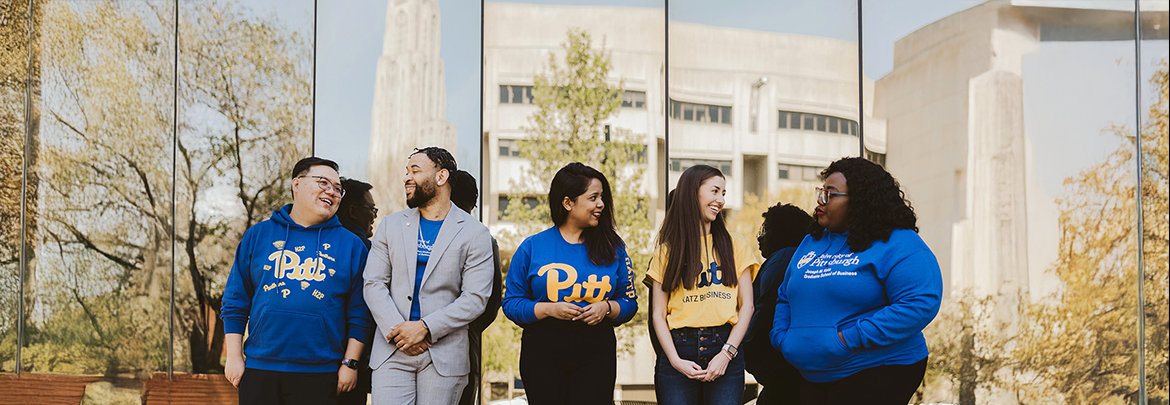 group of Katz Business School students standing outside of Mervis Hall