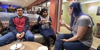 grad students attending opening reception of grad lounge