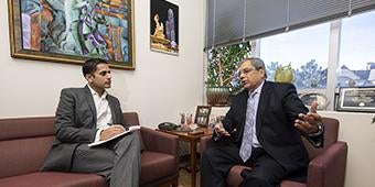 MBA student meeting with his advisor in an office