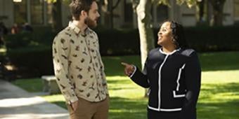 social work grad students talking on cathedral lawn